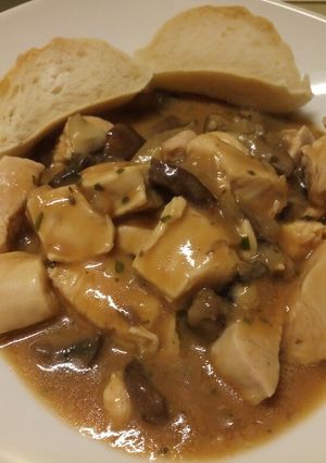 A picture of Chicken in a mushroom and tarragon sauce.