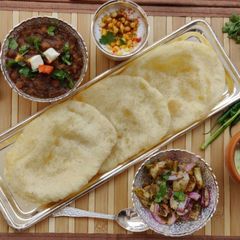 A picture of 100% Ever-soft bhathuras & secret chole.