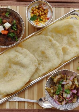 A picture of 100% Ever-soft bhathuras & secret chole.