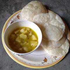 Luchi are aloor torkari A picture of Luchi are aloor torkari.