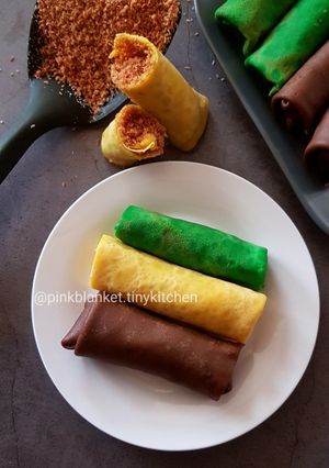 A picture of Flavoured Rolled Crepes with Toasted Coconut Filling.
