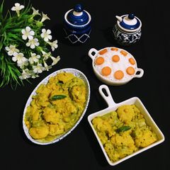 Jal Bhara Chichinga / Steamed fritters in Snake Gourd curry A picture of Jal Bhara Chichinga / Steamed fritters in Snake Gourd curry.