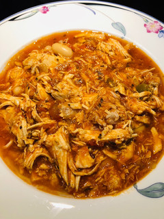 A picture of Shredded Chicken 🐔 Tomato 🍅 Soup 🍜.