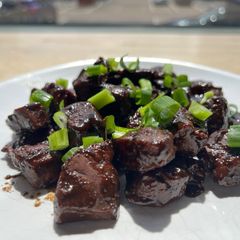 A picture of Lebanese style beef liver with pomegranate molasses.