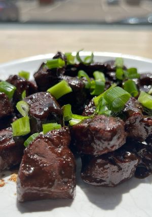 A picture of Lebanese style beef liver with pomegranate molasses.