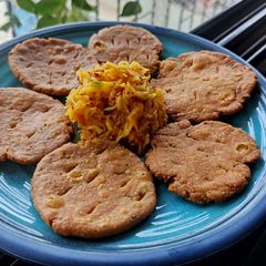 A picture of Basic mathri with mango pickle.
