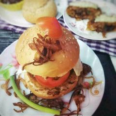 A picture of Centrefilled caramalized Fish Burger .