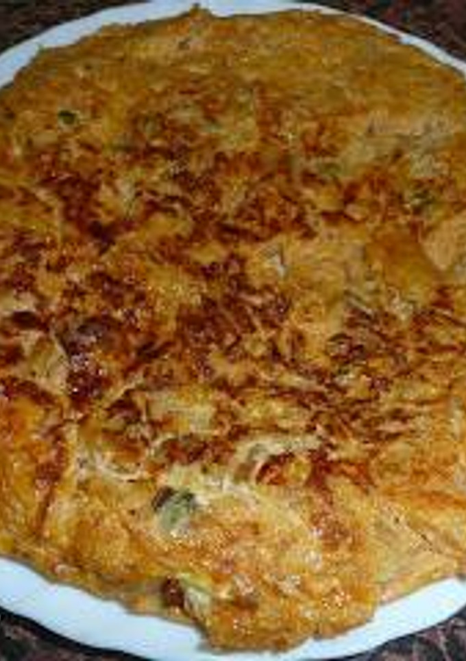 Una foto de Tortilla de berberechos y picatostes