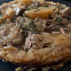 A picture of Braised lamb Kleftiko with filo pastry and feta.