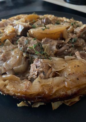 A picture of Braised lamb Kleftiko with filo pastry and feta.