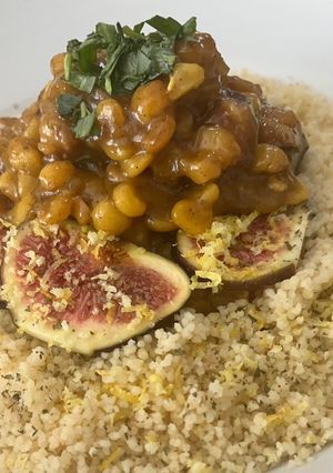 A picture of Ouzo marinated figs with chickpeas and couscous.