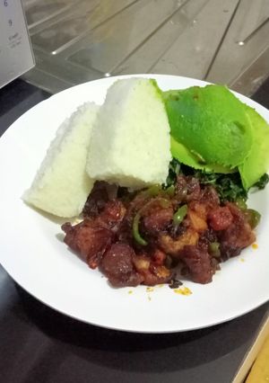 A picture of Ugali,pork,greens.