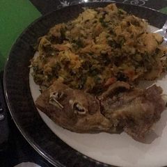 A picture of Porridge Yam with Fried Turkey.