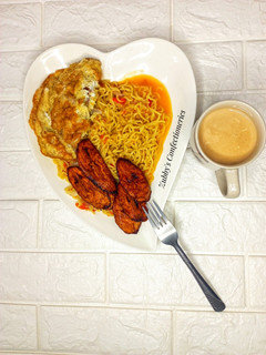 A picture of Pepperish noodles with egg & ginger tea 🍵.
