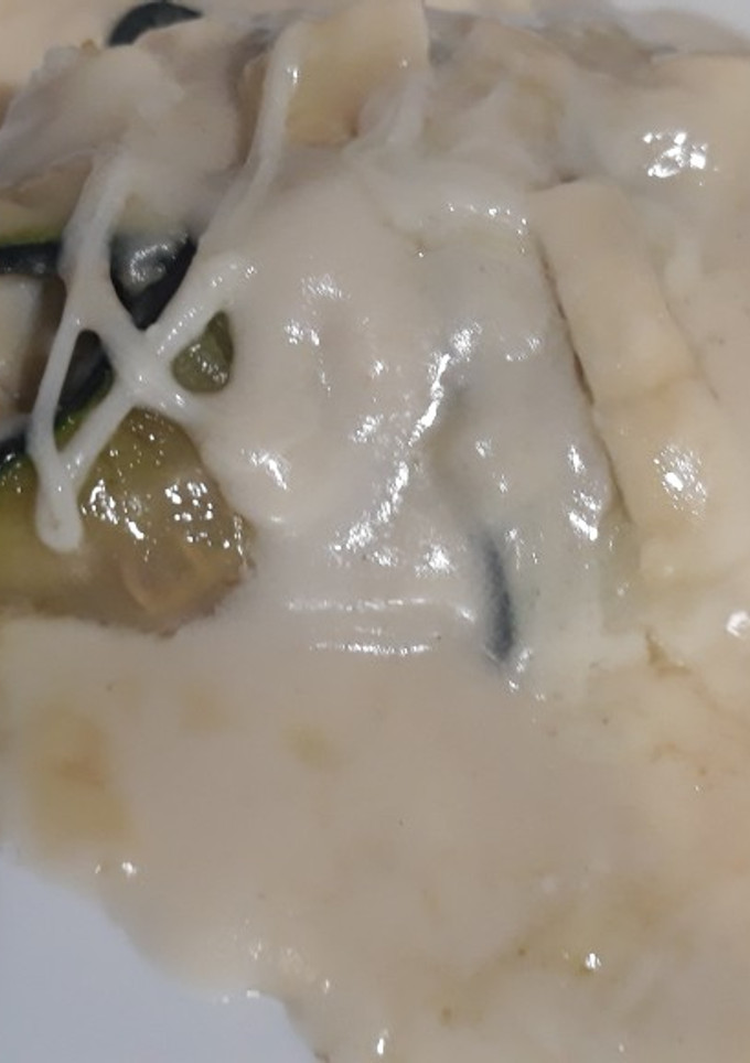 Una foto de Canelones de calabacín rellenos
