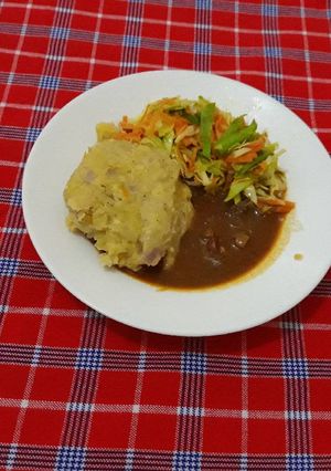 A picture of Ginger mashed Green banana(matoke) Beef stew cabbage and carrots.