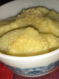 Una foto de Papas con salsa blanca al horno