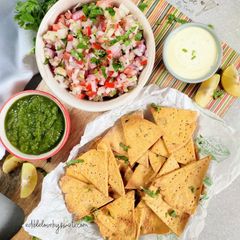 A picture of Baked Missi Roti Nachos kuchumbar salsa kehri ki chutney.