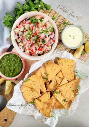A picture of Baked Missi Roti Nachos kuchumbar salsa kehri ki chutney.