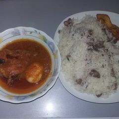A picture of Cat fish stew and rice wit beans.