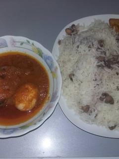 A picture of Cat fish stew and rice wit beans.