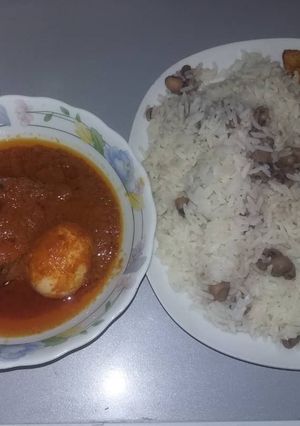 A picture of Cat fish stew and rice wit beans.