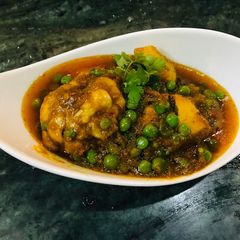 A picture of Tri spices chicken matar.