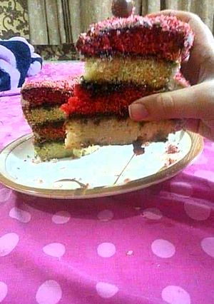 A picture of 4 layer vanilla red cake.