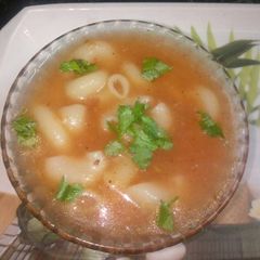 A picture of Tomato macaroni soup.