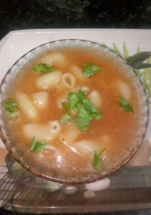 A picture of Tomato macaroni soup.