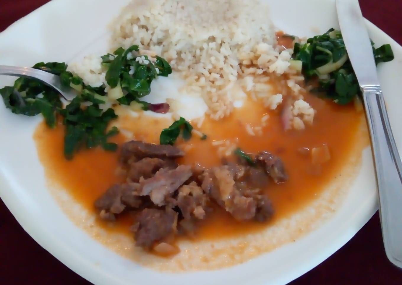 Rice pillaf with beef stew and saute spinach