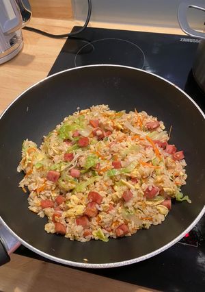 A picture of Fried rice with spam, egg and lettuce.