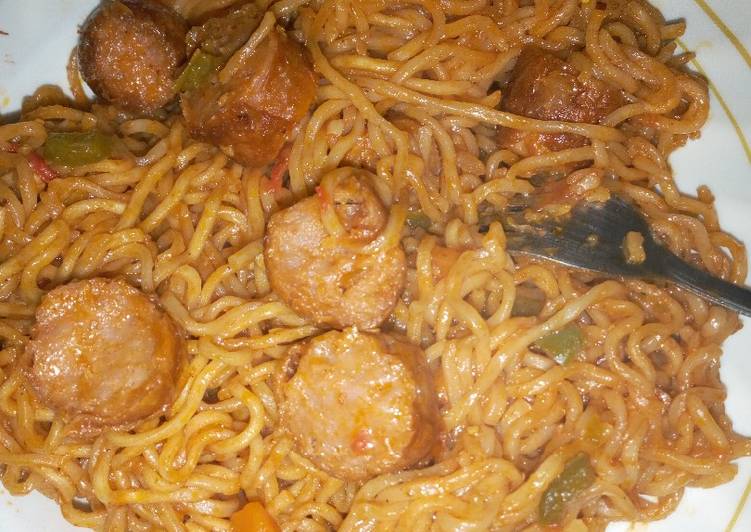Tasty fried indomie noodles with sausages
