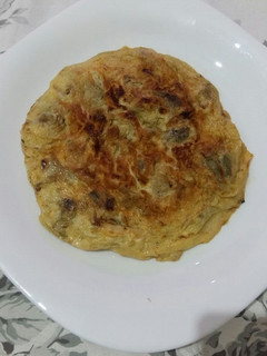 Una foto de Tortilla con alcachofas