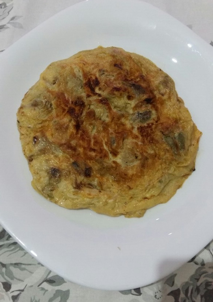 Una foto de Tortilla con alcachofas