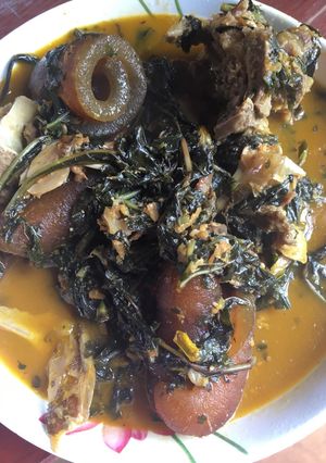 A picture of Bitter leaf soup with assorted meat.