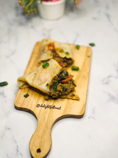 A picture of Savoury crepe with minced meat fillings.