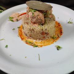 A picture of Dahi panner kofta curry with hyacinth pulav.
