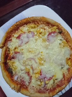 A picture of Pizza 🍕 in pan fastest way to serve.