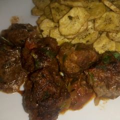 A picture of Cheesy meatballs in sauce.
