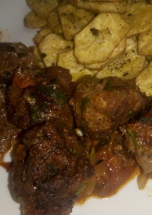 A picture of Cheesy meatballs in sauce.