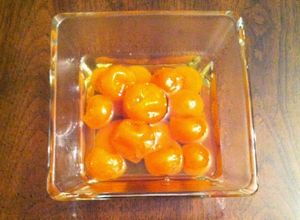 Una foto de Kumquats en almíbar