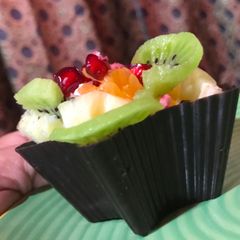 A picture of Chocolate Cups filled with Pastry Cream and Fresh Fruits.
