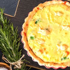 A picture of Pie with broccoli and smoked trout.