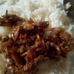 A picture of Boiled rice with minced fish sauce.