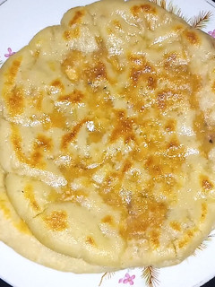 A picture of Achari Chicken Naan.