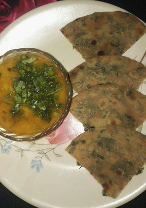 A picture of Dhania parantha with aloo tamatar ki rasedar sabji.