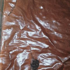 A picture of Flaky and fudgy brownies made with oil.
