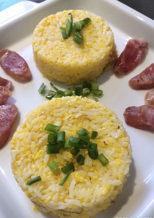 A picture of Egg Fried Rice with Sausages.