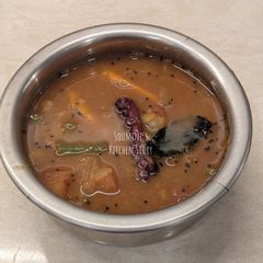 A picture of Sambar in pressure cooker.